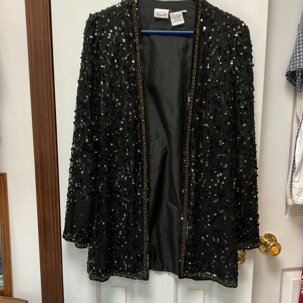 Sequins on 100percent silk shell, polyester liner. Sequins & beads-intricate.